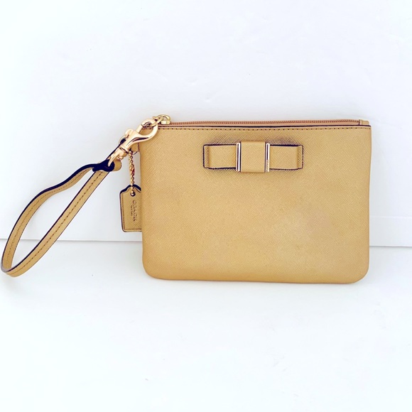 Coach Handbags - Coach Leather Wristlet Gold Good Condition